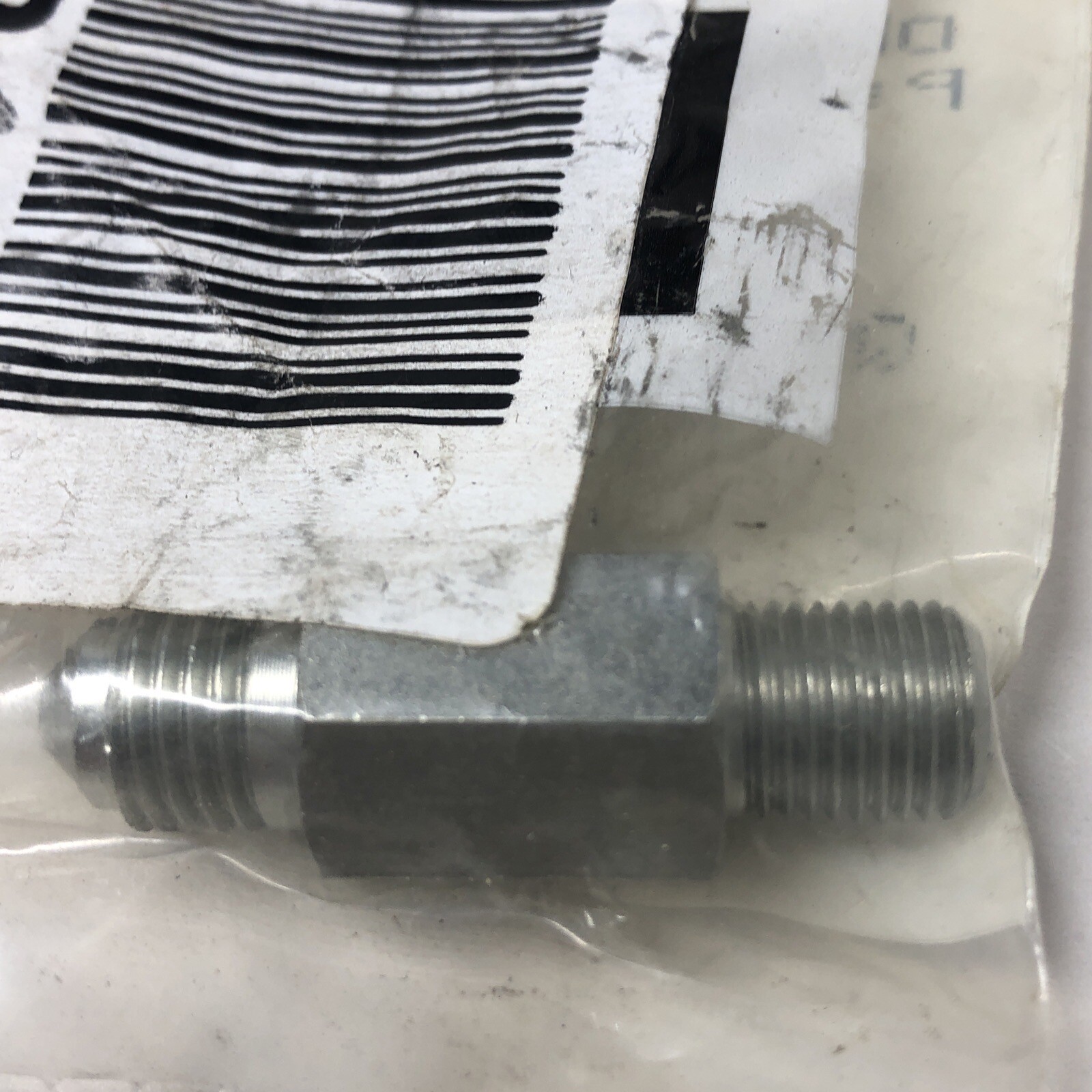Cummins 4938641 Male Union M 1/8″ NPT to M 1/4″ JIC, Dash 2 NPT to Dash 4 JIC