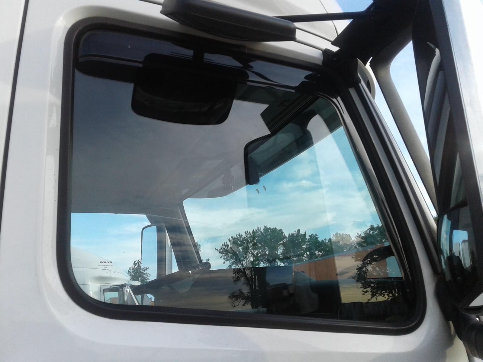 Wind and rain deflectors for Volvo VNL models semi trucks.