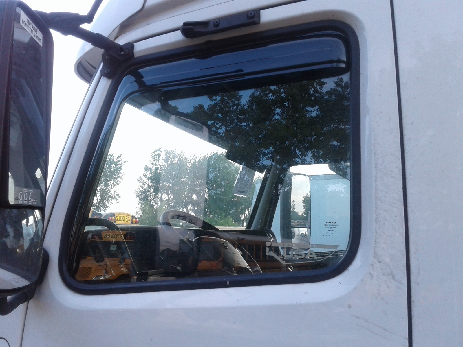 Wind and rain deflectors for Volvo VNL models semi trucks.