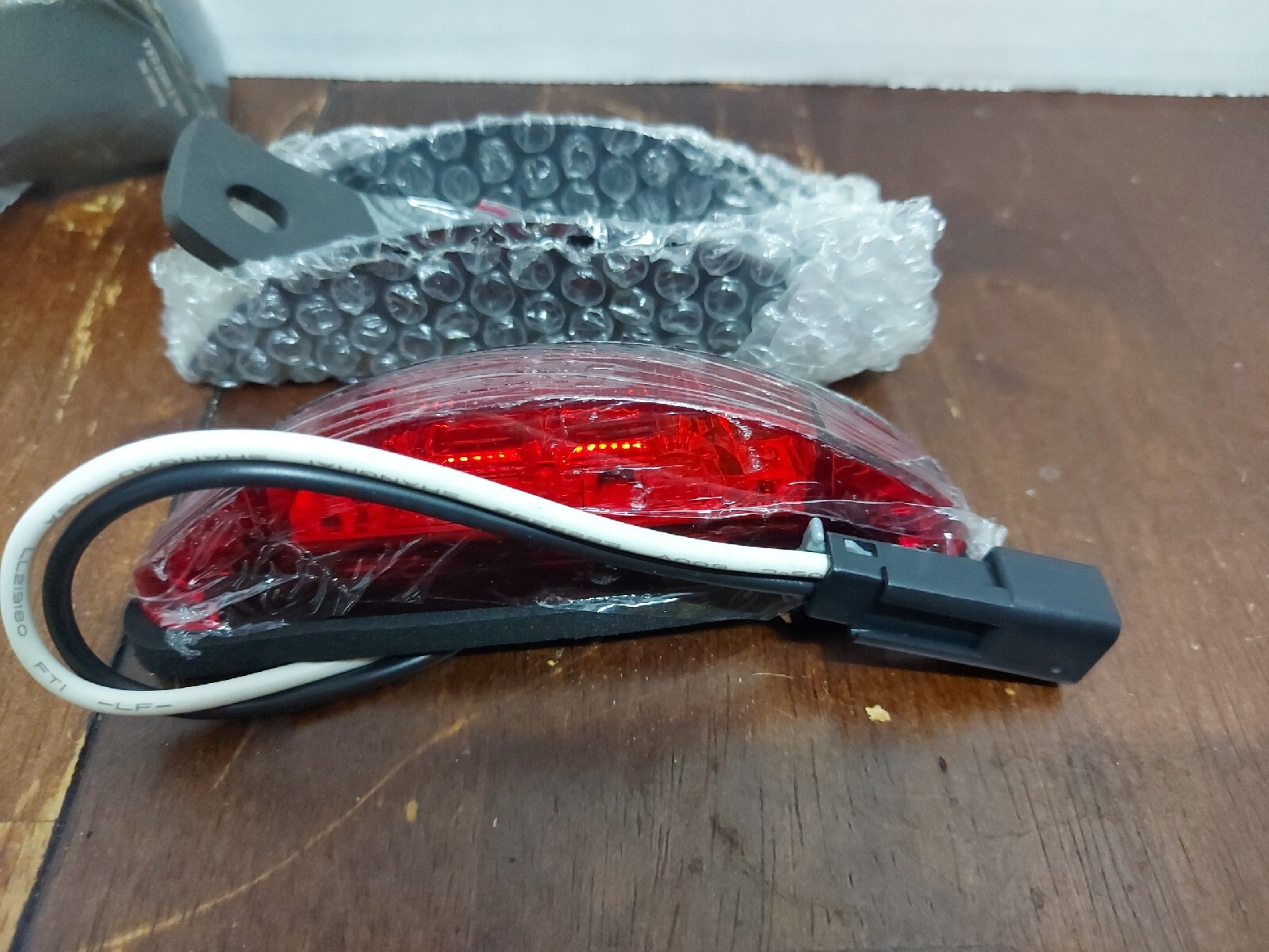 NOS International 2230562c1 LIGHT MARKER, LED, ARMORED, RED. (SOUND OFF)